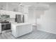 Bright kitchen features an island, stainless appliances, and tiled floor at 4167 Seton Cir, Palm Harbor, FL 34683