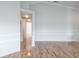 Open-concept living room with hardwood floors and neutral paint scheme at 4167 Seton Cir, Palm Harbor, FL 34683