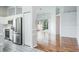 Bright living room with sleek stainless steel appliances and hardwood flooring at 4167 Seton Cir, Palm Harbor, FL 34683