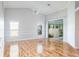Spacious living room featuring hardwood floors, crown molding, and ample natural light at 4167 Seton Cir, Palm Harbor, FL 34683