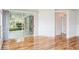 Bright living room features hardwood floors and sliding glass doors to the lanai at 4167 Seton Cir, Palm Harbor, FL 34683