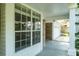 Covered porch detail with view of a two-car garage at 4167 Seton Cir, Palm Harbor, FL 34683