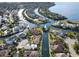 A scenic aerial view of waterfront homes, canals, and a lush landscape in a beautiful coastal community at 4615 Shark Dr, Bradenton, FL 34208