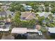 A beautiful aerial view captures the home with its boat dock, lush landscaping, and waterfront location at 4615 Shark Dr, Bradenton, FL 34208