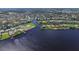 A beautiful aerial view of a waterfront community featuring multiple canals, waterways, and lush landscaping at 4615 Shark Dr, Bradenton, FL 34208