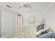 Comfortable bedroom with fan, closet, and light color scheme for a relaxing space at 4615 Shark Dr, Bradenton, FL 34208