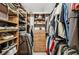 Well-organized closet with wooden shelves and hanging rods for maximum storage at 4615 Shark Dr, Bradenton, FL 34208