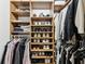 Organized closet with shelving and hanging rods for storing clothing and shoes at 4615 Shark Dr, Bradenton, FL 34208