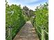 Picturesque community bridge with lush greenery, providing a peaceful walkway in a serene setting at 4615 Shark Dr, Bradenton, FL 34208