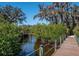 Another picturesque community bridge with lush greenery, providing a peaceful walkway in a serene setting at 4615 Shark Dr, Bradenton, FL 34208