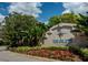 The Inlets at Riverdale community entrance sign surrounded by manicured flower beds and lush greenery at 4615 Shark Dr, Bradenton, FL 34208