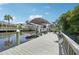 Spacious wooden dock with boat lift, providing easy access to the waterfront and surrounding scenery at 4615 Shark Dr, Bradenton, FL 34208