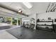 Spacious garage equipped with fitness equipment, bikes, and outdoor access at 4615 Shark Dr, Bradenton, FL 34208