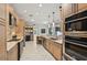 Bright kitchen with stainless appliances, stone countertops, and lots of storage at 4615 Shark Dr, Bradenton, FL 34208