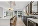 A bar top with wine fridge and serving area is adjacent to an open floor plan with views to the exterior at 4615 Shark Dr, Bradenton, FL 34208
