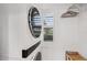 Clean, white laundry room featuring modern washer and dryer units at 4615 Shark Dr, Bradenton, FL 34208