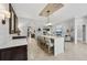 This open-concept living area features a large island and bar with seating adjacent to a living space at 4615 Shark Dr, Bradenton, FL 34208