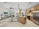 Open floor plan features a large kitchen island, stainless appliances and an adjacent living space with sliding glass doors at 4615 Shark Dr, Bradenton, FL 34208