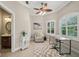 This home office provides natural lighting, neutral colors and a comfortable chair with views to the exterior at 4615 Shark Dr, Bradenton, FL 34208