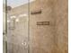 Detailed shot of the shower space, featuring stone-look tiling and a glass enclosure at 4615 Shark Dr, Bradenton, FL 34208