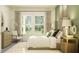 Charming bedroom with ample natural light, decorative art, and cozy seating, creating a relaxing space at 4765 Southern Valley Loop, Brooksville, FL 34601