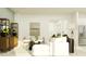 Open-concept living area with stylish furniture, TV, and natural light at 4765 Southern Valley Loop, Brooksville, FL 34601