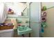 Charming bathroom with green sink and a fully enclosed shower featuring vibrant tile and fixtures at 4917 99Th N St, St Petersburg, FL 33708
