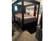 Stylish bedroom with four-poster bed, neutral colors, and unique decor elements at 4917 99Th N St, St Petersburg, FL 33708