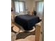 Comfortable bedroom featuring a large bed, soft lighting, and neutral decor at 4917 99Th N St, St Petersburg, FL 33708