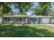 Charming single-story home with a well-maintained front yard and attached one car garage at 4917 99Th N St, St Petersburg, FL 33708