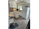 Cozy kitchen with white cabinets, island and modern appliances creating a comfortable cooking space at 4917 99Th N St, St Petersburg, FL 33708