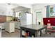 Functional kitchen with white cabinets, an island, and ample counter space at 4917 99Th N St, St Petersburg, FL 33708