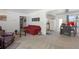 Spacious living room seamlessly connects to the kitchen, featuring cozy seating and ample light at 4917 99Th N St, St Petersburg, FL 33708