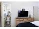 Bedroom with a connected bathroom and large dresser, providing a private retreat within the home at 4917 99Th N St, St Petersburg, FL 33708