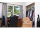 Inviting home office with a cozy chair, functional desk, and a view of the outdoors at 4917 99Th N St, St Petersburg, FL 33708