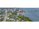 Aerial view highlights building near waterfront, bridge, city and lush landscape at 500 N Osceola Ave # 211, Clearwater, FL 33755