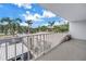 Balcony view showcases palm trees and lush landscaping creating an inviting outdoor living space at 500 N Osceola Ave # 211, Clearwater, FL 33755