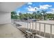 Spacious balcony provides stunning views of the parking and surrounding tropical landscape at 500 N Osceola Ave # 211, Clearwater, FL 33755