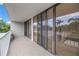 Spacious balcony with railing and a view of palm trees and exterior at 500 N Osceola Ave # 211, Clearwater, FL 33755