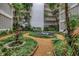 Picturesque courtyard featuring a central fountain, vibrant plants, and scenic views of the surrounding buildings at 500 N Osceola Ave # 211, Clearwater, FL 33755