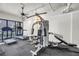 Well-equipped exercise room with a treadmill and multi-station weight machine at 500 N Osceola Ave # 211, Clearwater, FL 33755