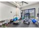 Well-equipped exercise room with a beautiful view of the water from the glass sliding door at 500 N Osceola Ave # 211, Clearwater, FL 33755
