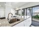 Modern kitchen with granite countertops and stainless sink offering scenic water views and lots of natural light at 500 N Osceola Ave # 211, Clearwater, FL 33755