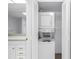 Convenient in-unit stacked washer and dryer in a laundry closet at 500 N Osceola Ave # 211, Clearwater, FL 33755