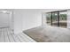 Living room showing the balcony access and sliding doors with view of the exterior at 500 N Osceola Ave # 211, Clearwater, FL 33755