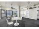Bright living area features white furniture and a sleek bar area with beautiful bay views at 500 N Osceola Ave # 211, Clearwater, FL 33755