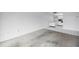 Spacious living room with kitchen access and neutral-colored walls and carpeting at 500 N Osceola Ave # 211, Clearwater, FL 33755