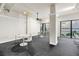 Bright living area features white furniture with floor-to-ceiling windows and beautiful water views at 500 N Osceola Ave # 211, Clearwater, FL 33755