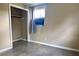 This cozy bedroom offers a closet and natural light from the window at 5016 S 86Th St, Tampa, FL 33619