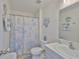This bathroom offers stylish coastal decor, a shower, and a sink with plentiful counter space at 5438 Summer Sunset Dr, Apollo Beach, FL 33572